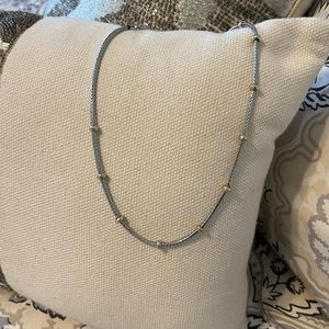Free with purchase only. Silver necklace either gold bead stations.